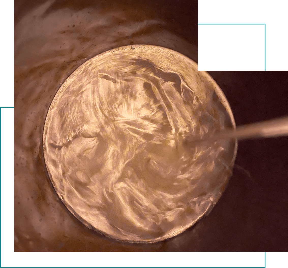 Swirling liquid in a metallic container.